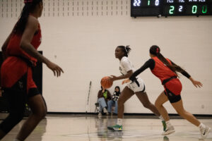Cianah Miller looks for passing options at the top of the key at the Jack Doyle Recreation Centre.