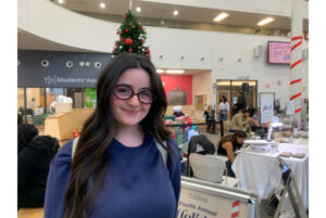 Molly Walker smiles in the Student Commons on Nov. 26.
