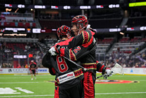Black Bears celebrate together after scoring a goal.
