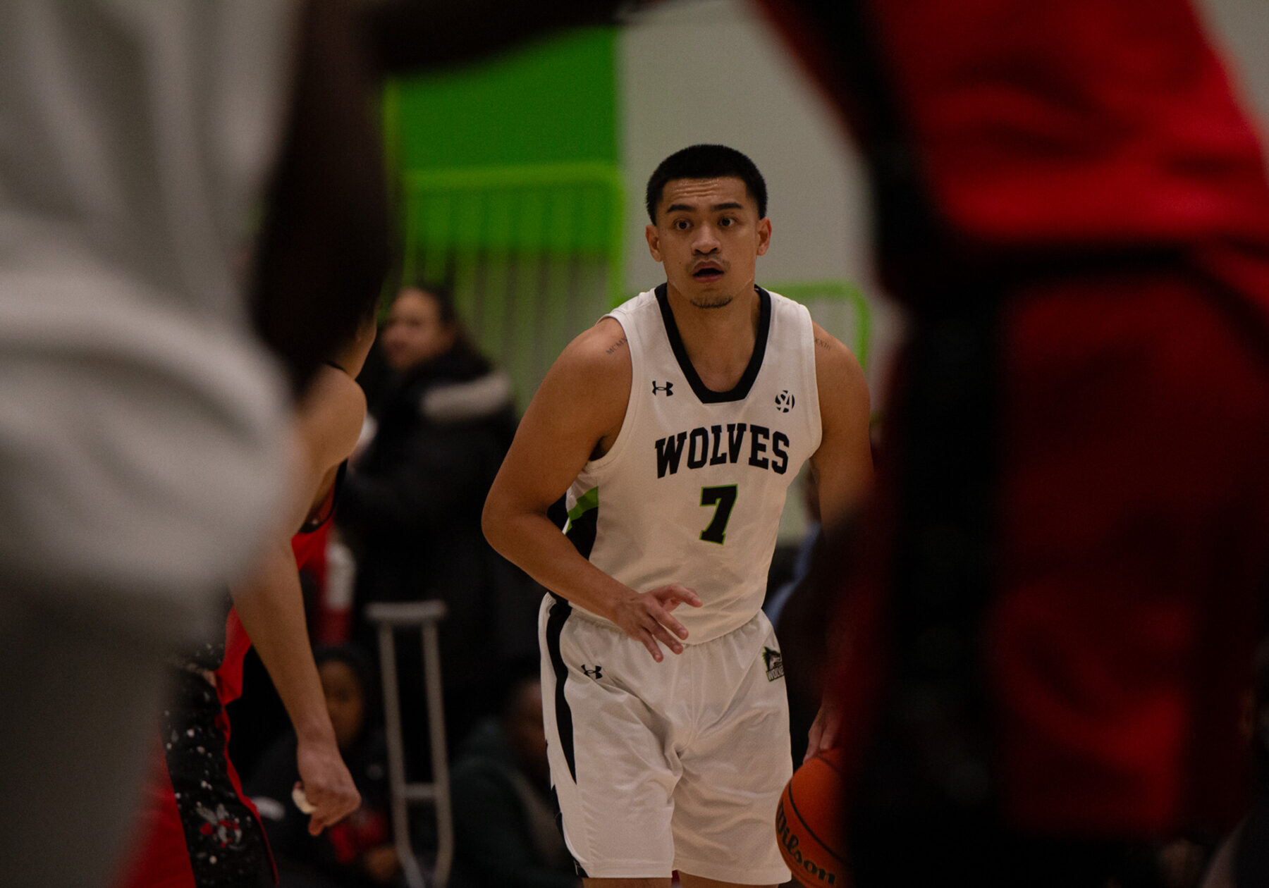 Algonquin Wolves guard Albert Opena dribbles the ball against Seneca on Nov. 28 at the Jack Doyle Athletics and Recreation Centre.