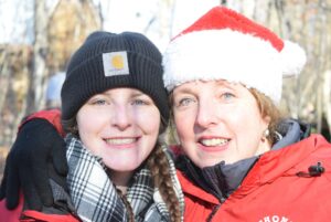 Sophie (Left) and Christine Thomas (Right) pose for a picture at Thomas Tree Farm during one of the busiest days this season on Nov. 29