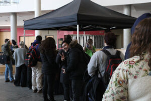 Student poses for a photo, eagerly lined up with others for the Fresh for $5 sale at Algonquin College on Jan 22.