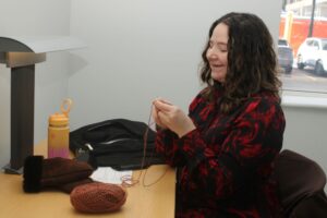 Elizabeth St-Charles crochets with a smile after her day of classes comes to an end.