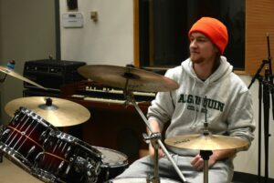 Charlie Buxton MIA student rehearses drums at Algonquin College as the Music Industry Arts program faces potential cuts.