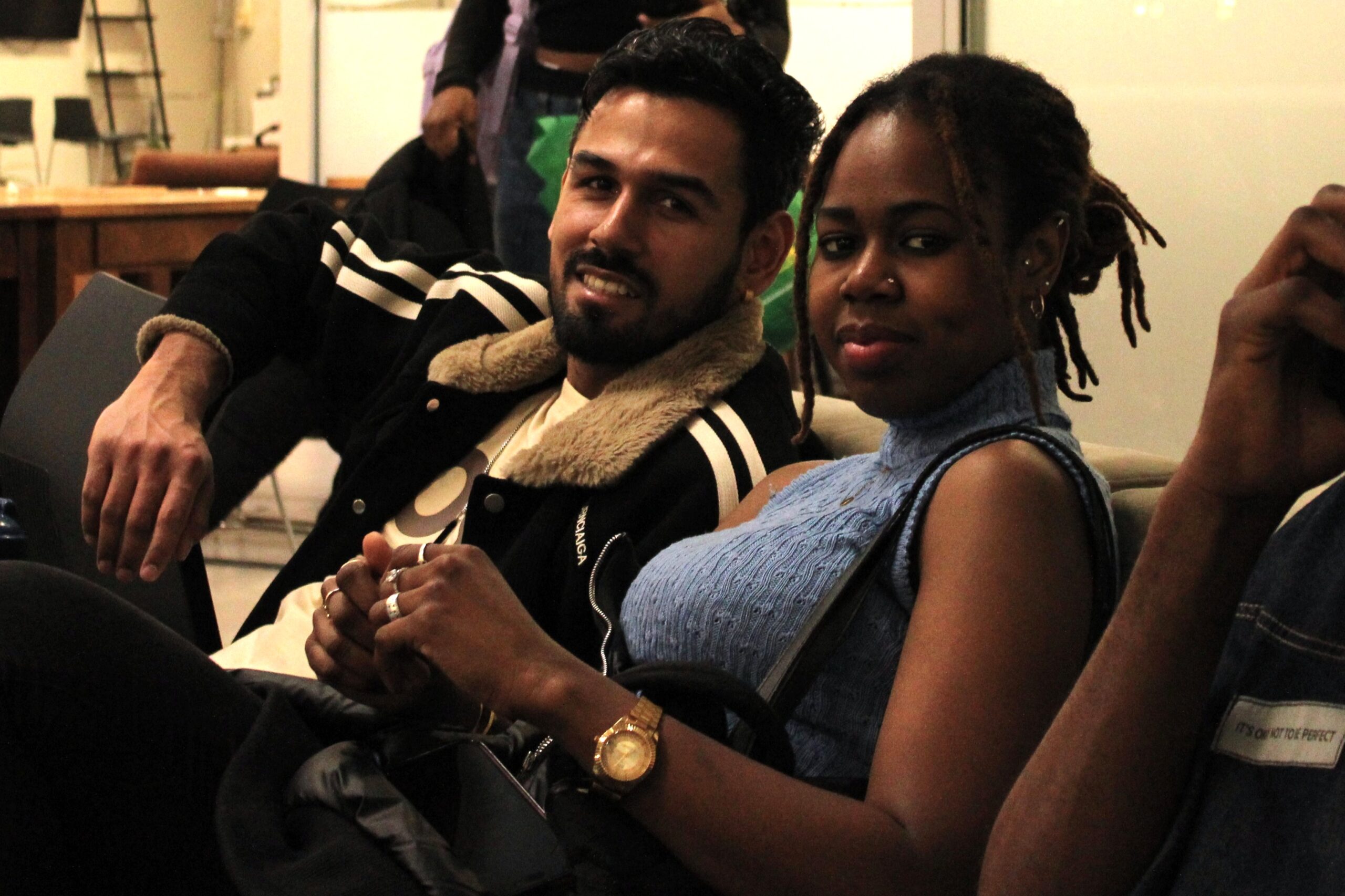 Students lounging at the AC Hub before the movie viewing.