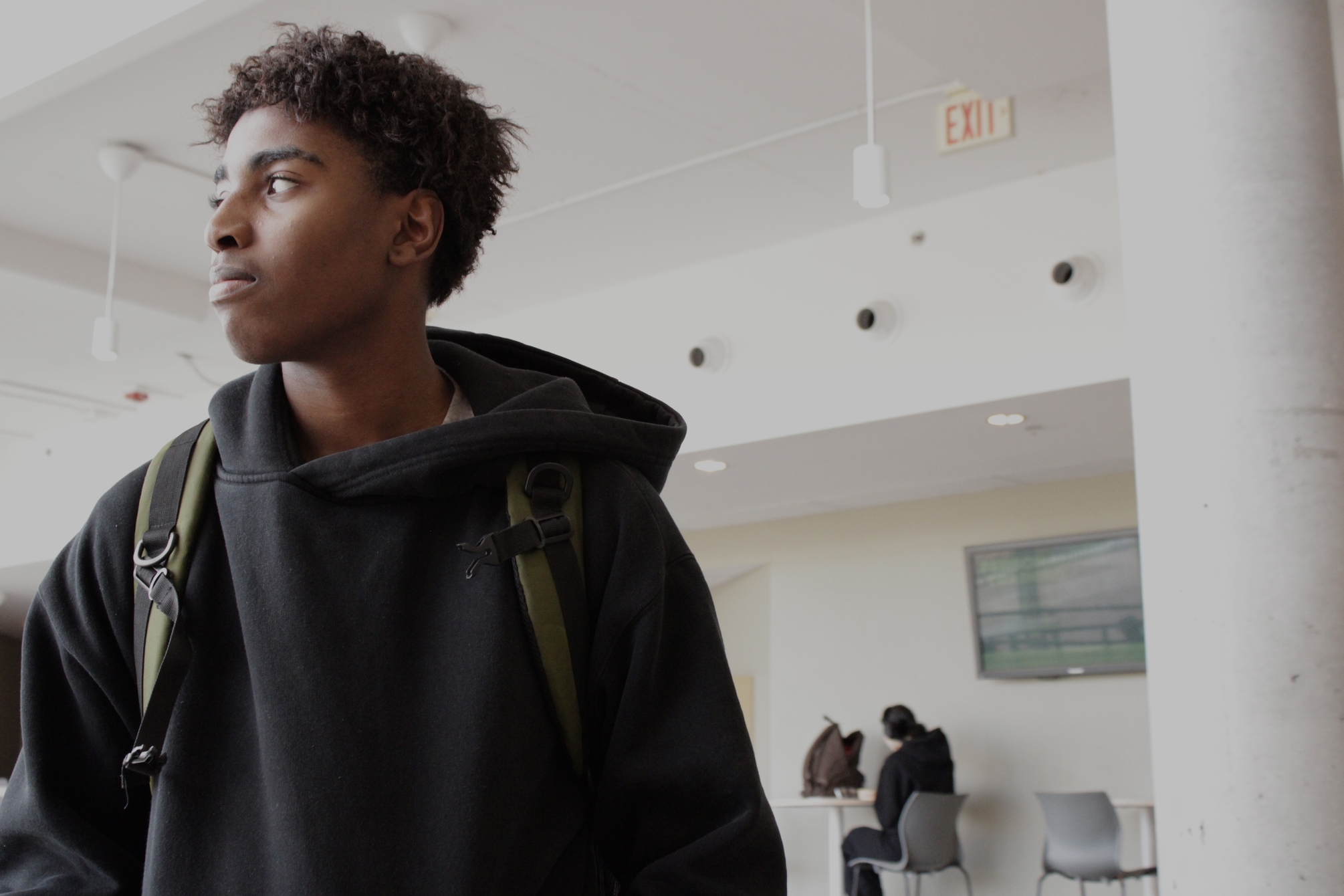 Jahvon Flowers, a student at Algonquin College, looks across the campus commons on Tuesday, March 10, 2026. Flowers was spending time between classes at the college’s main campus.