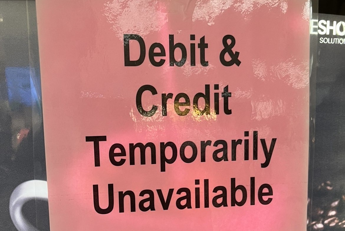 A sign about the debit and credit machines going down, due to the power outage.