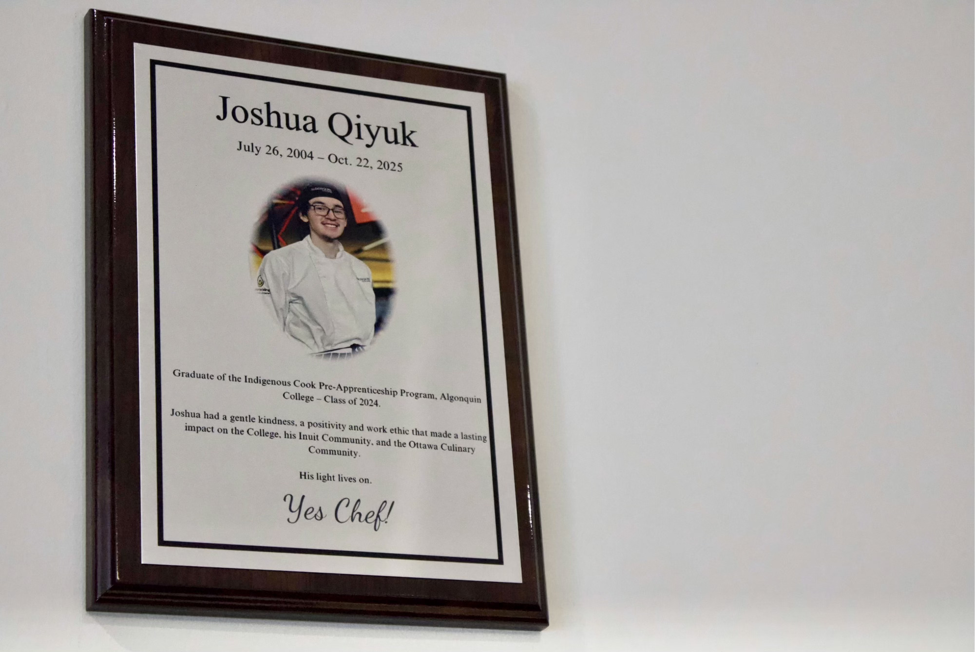 The memorial plaque made in honour of Joshua Qiyuk hangs in the Mamidosewin Centre at Algonquin College.