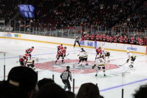 Tomas Pobezal (Kingston) takes opening face-off against Zach Houben at TD Place on March 27, 2026