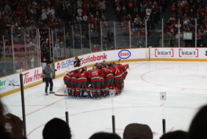 The Ottawa Charge huddle up by their goalie net before their final regular season game on April 25 at TD Place.