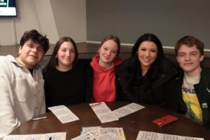 Friends pose between rounds at Dirty Bingo’s 15‑year anniversary.