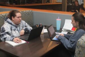 Cheyane Lamothe (left) and Krystal Taillefer (right) focusing on work at the Observatory.