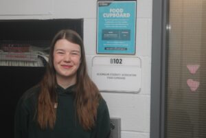 Abby Muir manages the Food Cupboard located in room B102 of the B-building.