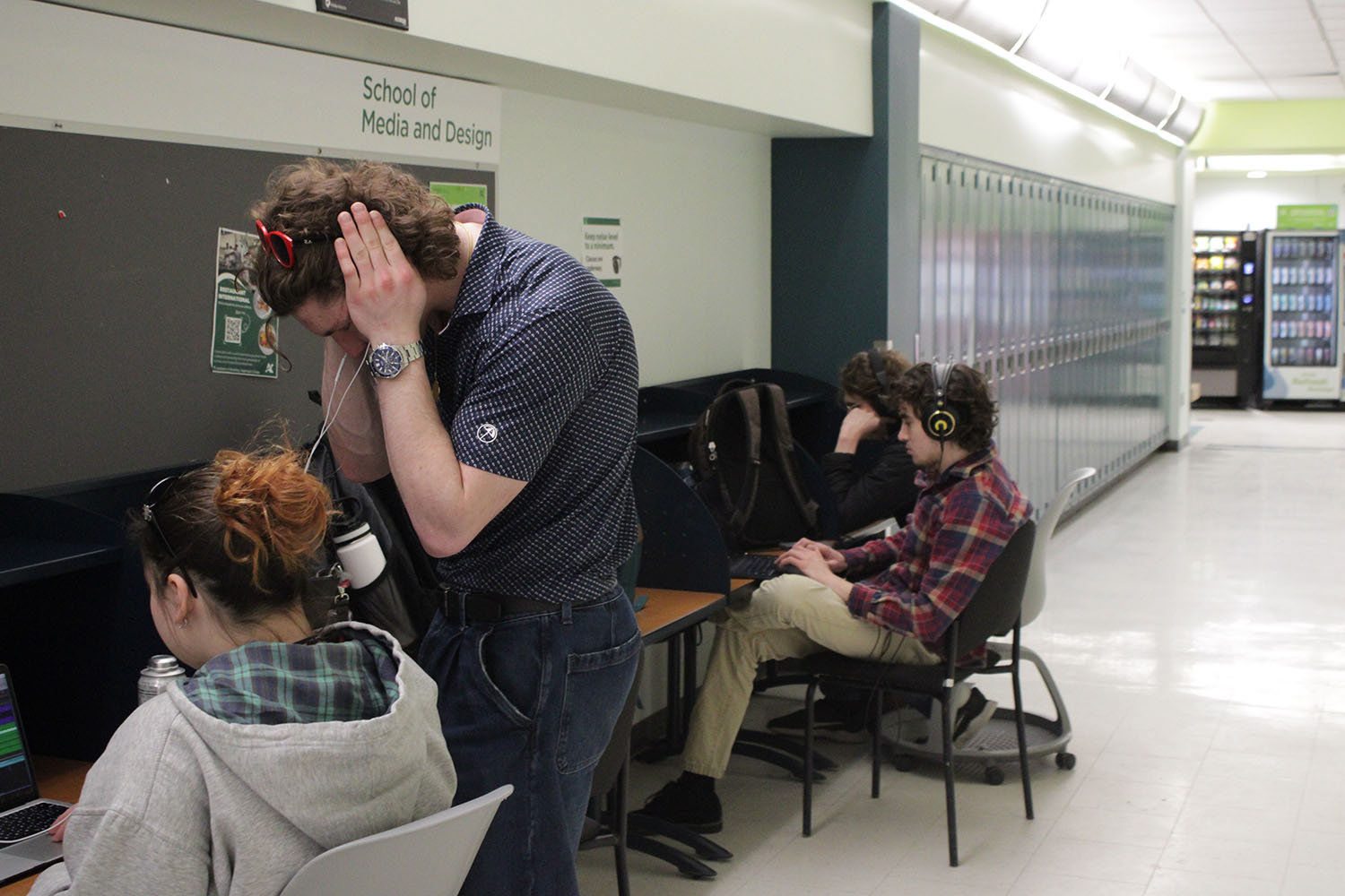 Cameron McSherry and Genna Bailey, students in the Music Arts Industry program at Algonquin College, collaborate on a project in the N-building hallway, one of their preferred places to study.