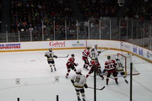 Kingston's Jack Dever (bottom) takes shot on goal on Ryder Fetterolf during game two of first round series on March 27, 2026 at TD Place