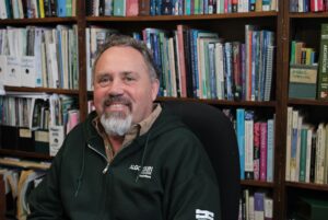 Tommy Wingreen in his office. Wingreen has been the horticulture program coordinator for 14 years and worries about the loss of spaces like the greenhouse.