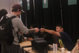 One of the many students recieving their U-Pass card in the D-building.