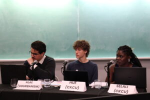 As moderators, Alae Boufarrachene (left), Hue Hetherington (centre) and Selali Ayitey-Wallace (right) asked questions and made rebuttals throughout the debate