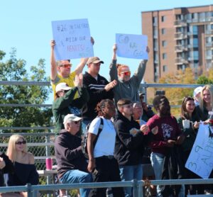 Algonquin soccer fans holding up signs made during the half time sign making competition