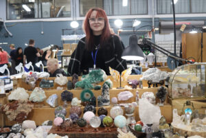 Janelle Guillmette showcasing the crystals on her table for Candy's Crystals at the event.