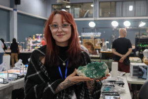 Janelle Guillemette, a vendor for Candy's Crystals, holding minerals