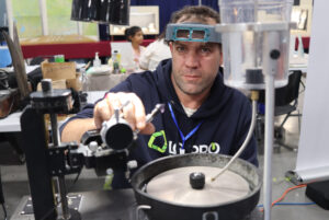 John Lavoie, faceting a gemstone to demonstrate the club's workshop to the public