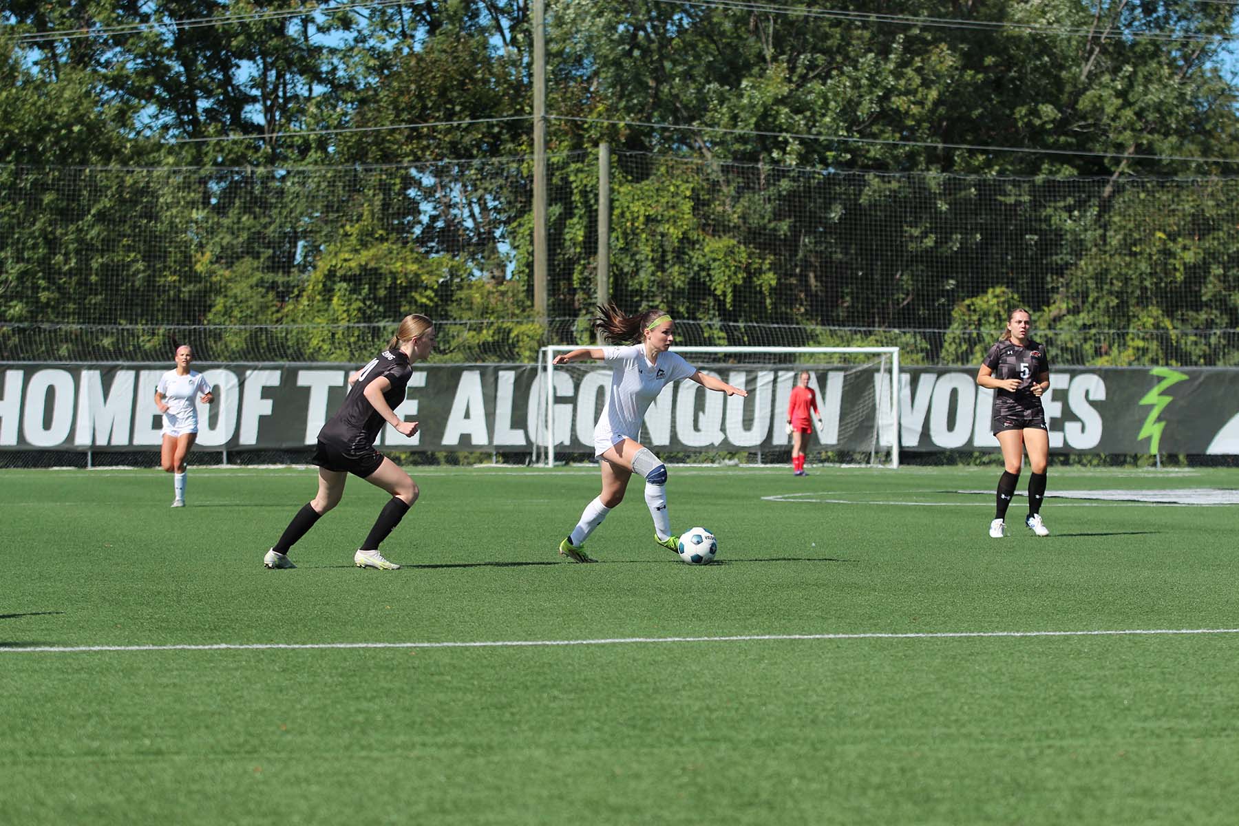 Midfielder Annika Dubeau dribbling down centerfield.