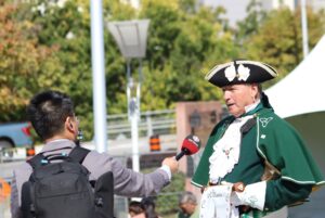 Ottawa's town crier Daniel Richer being interviewed by CBC news at the Ottawa 200 Block Party.