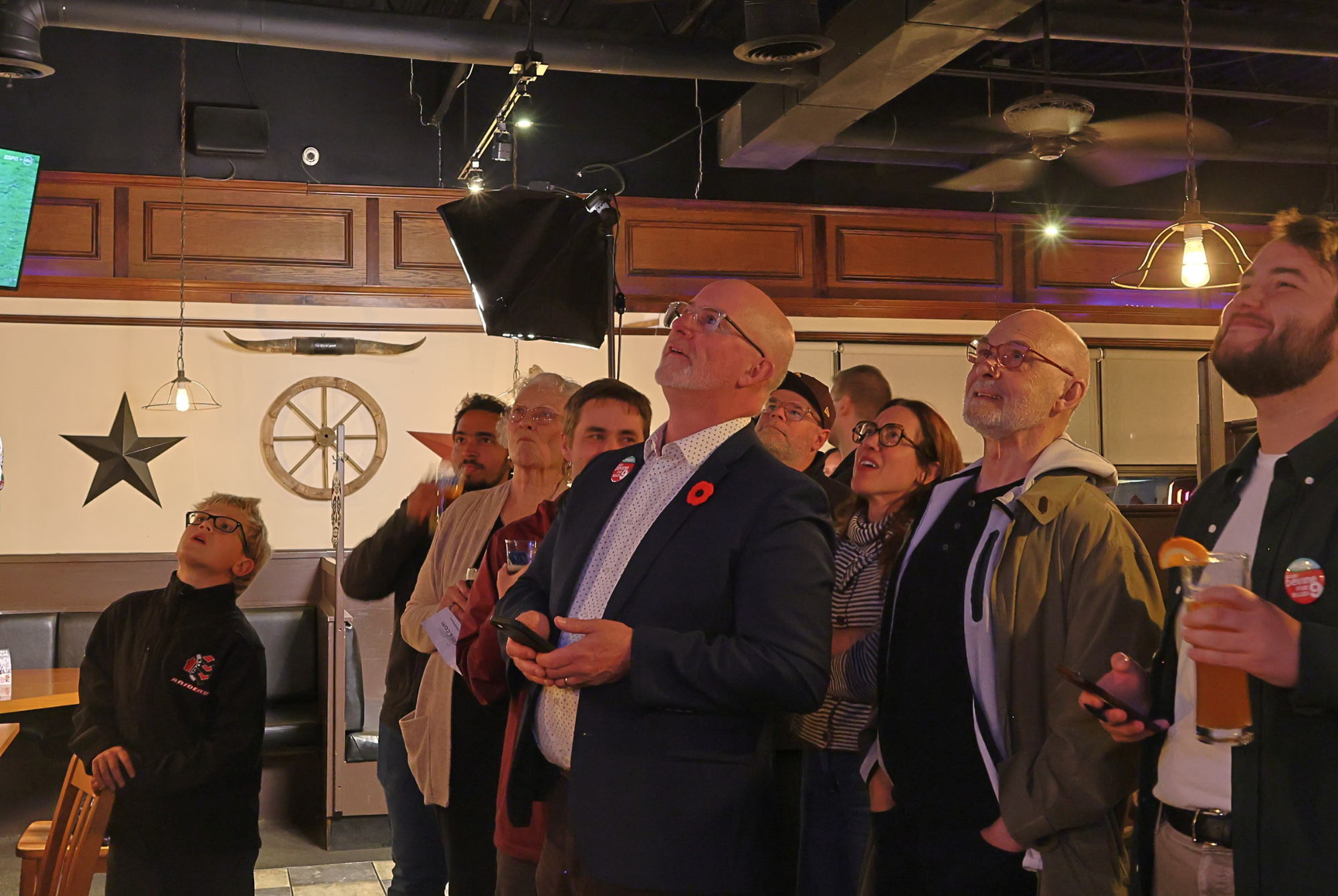 Knoxdale-Merivale councillor Sean Devine and his supporters watch the results come in at his election-night party at Fitz’s Classic Grill BBQ Smoke House in Nepean on Monday, Oct. 26.