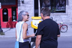 Photo of Alan Lori interacting with the Awesome Box, Sept 26, 2026.