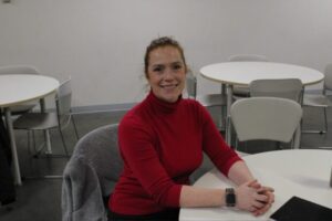 Councillor Laine Johnson, backstage, poses for a photo before joining the rest of the council members on stage at the Algonquin College town hall on Jan. 29.