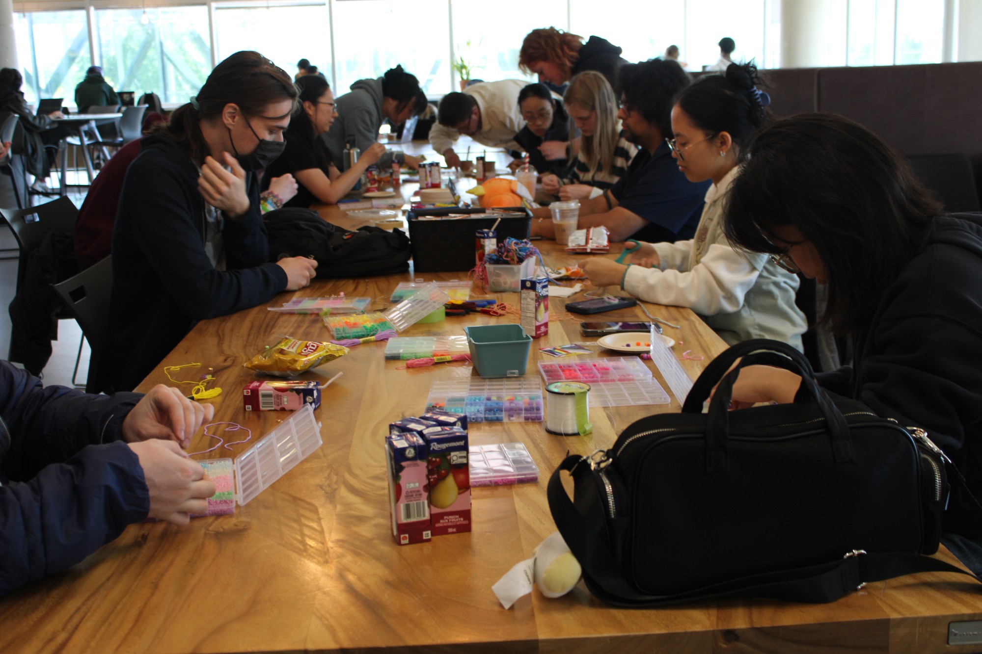 Students making bracelets in the AC Hub.