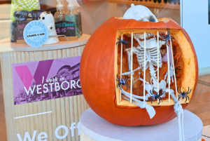 A skeleton peers out from a carved pumpkin- s contestant for the pumpkin carving competition